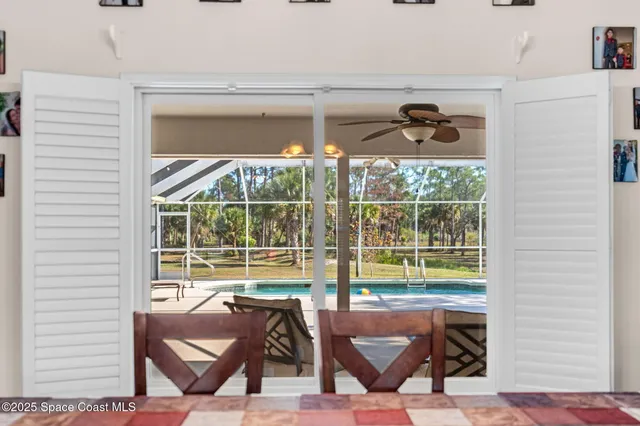 a view of a livingroom with furniture window and a fireplace