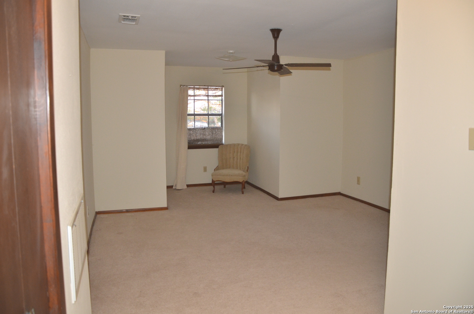 115 B Littleton Drive Devine, TX 78016 - Photo 14 of 27 a view of a room that has a window in it
