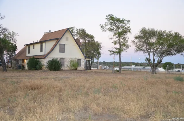 a view of a house with a street
