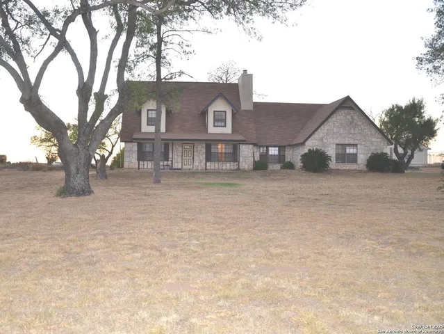 a view of a house with a snow in the yard