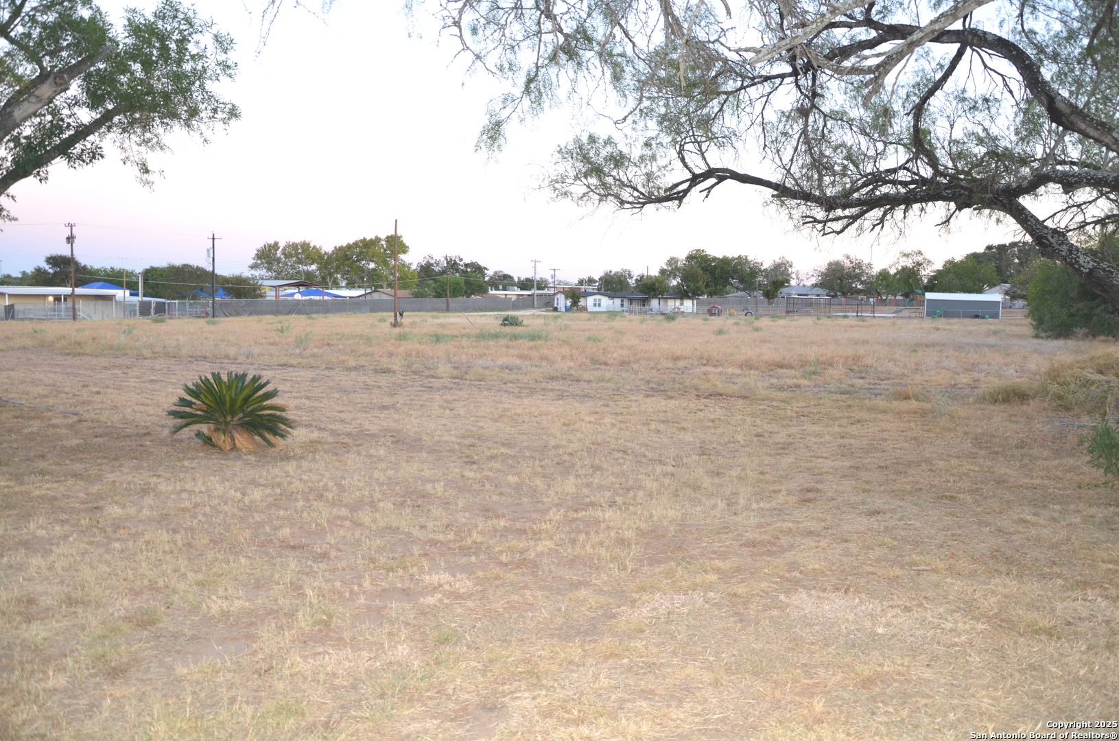 115 B Littleton Drive Devine, TX 78016 - Photo 23 of 27 a view of lake with green field