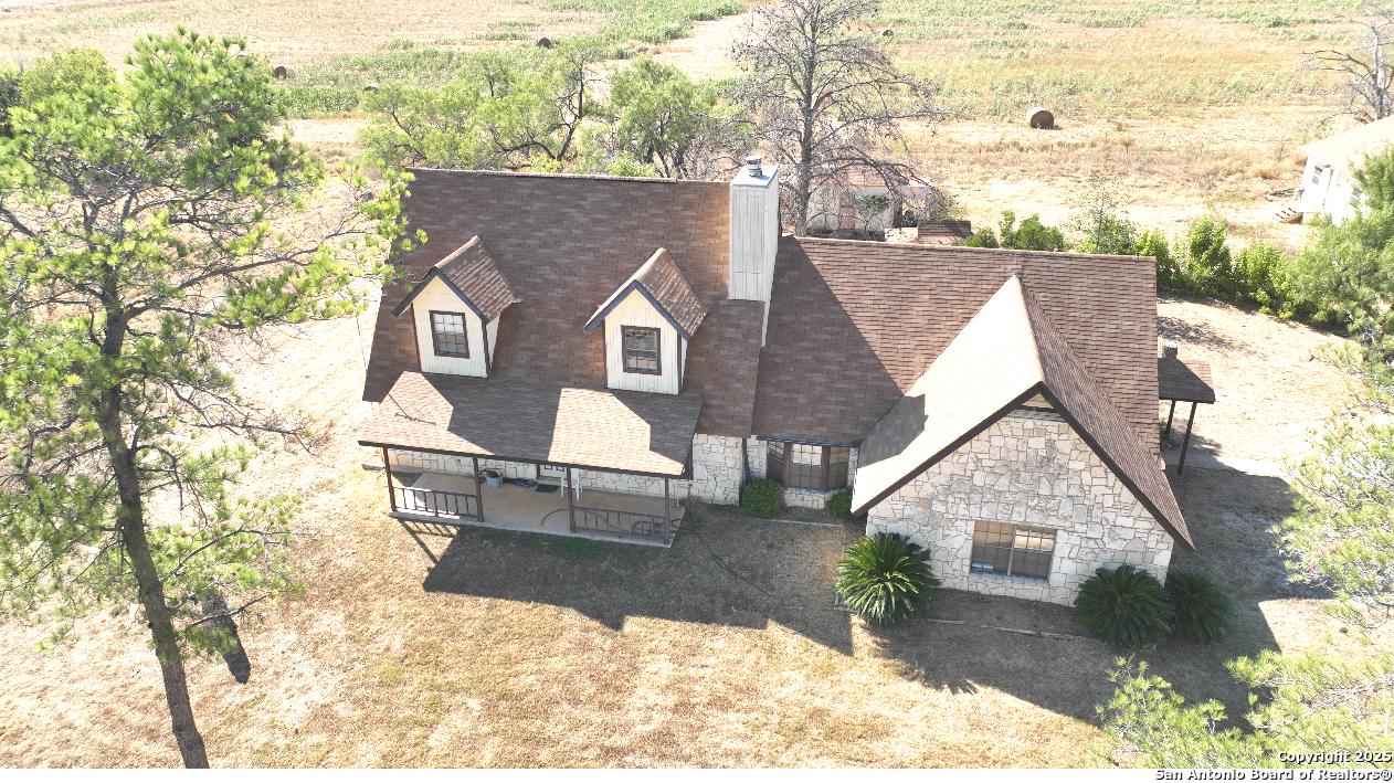 115 B Littleton Drive Devine, TX 78016 - Photo 25 of 27 a view of house with a outdoor space