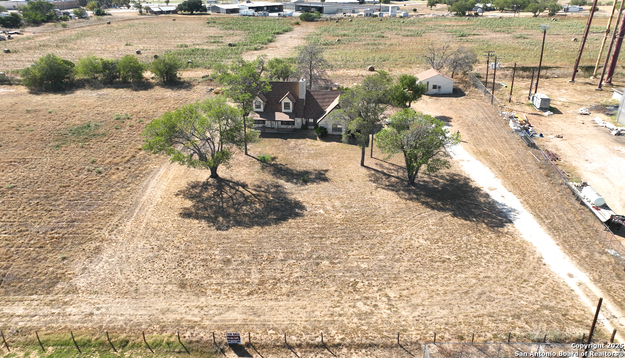 115 B Littleton Drive Devine, TX 78016 - Photo 26 of 27 a view of a lake with beach