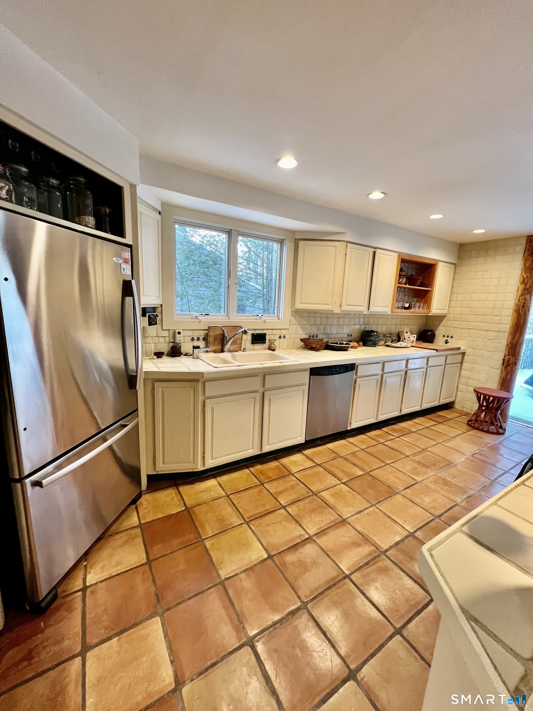 290 Cliffside Drive Torrington, CT 06790 - Photo 11 of 40 a kitchen with stainless steel appliances granite countertop a refrigerator sink and cabinets