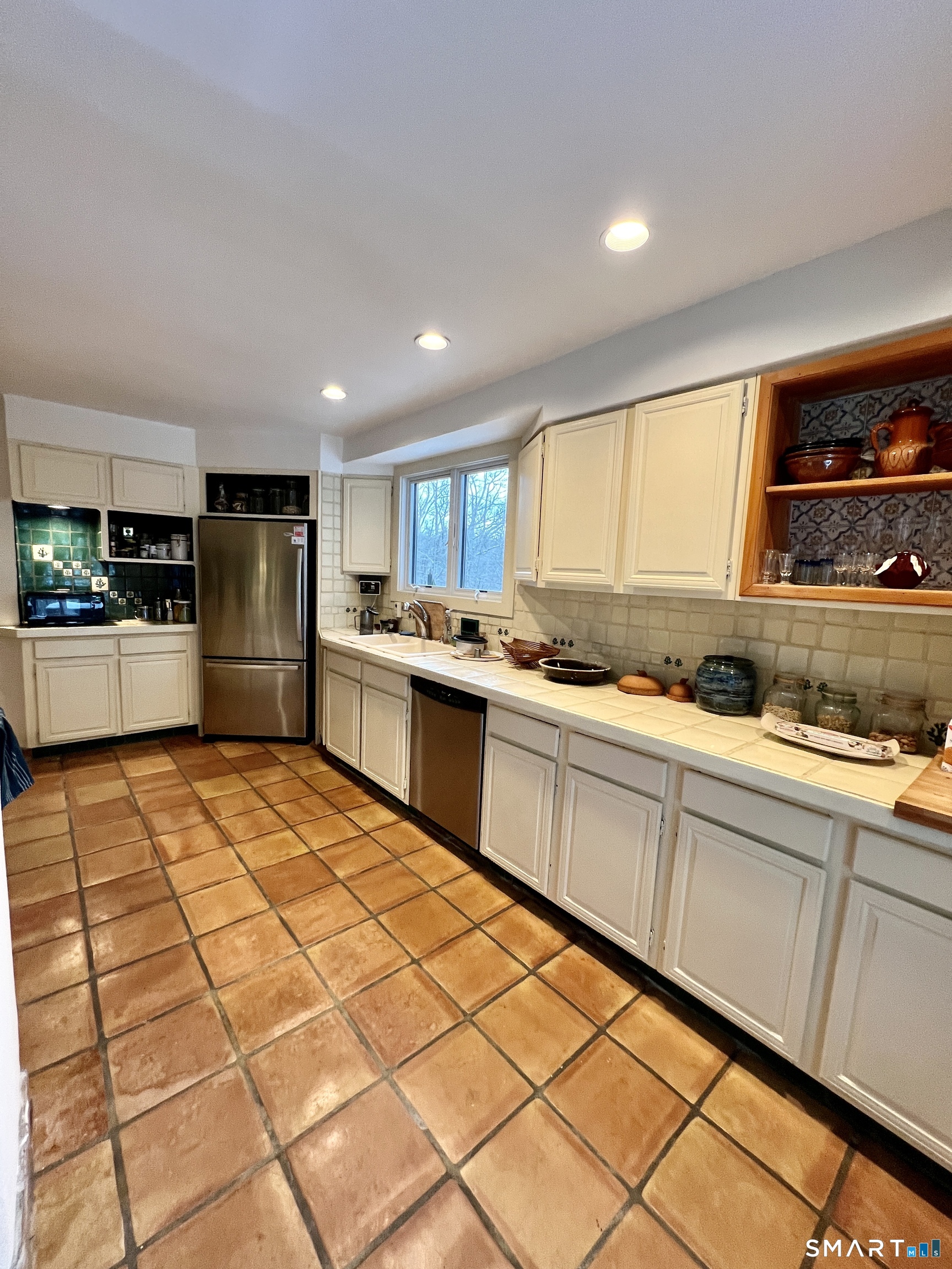 290 Cliffside Drive Torrington, CT 06790 - Photo 12 of 40 a kitchen with stainless steel appliances granite countertop a refrigerator and a stove top oven