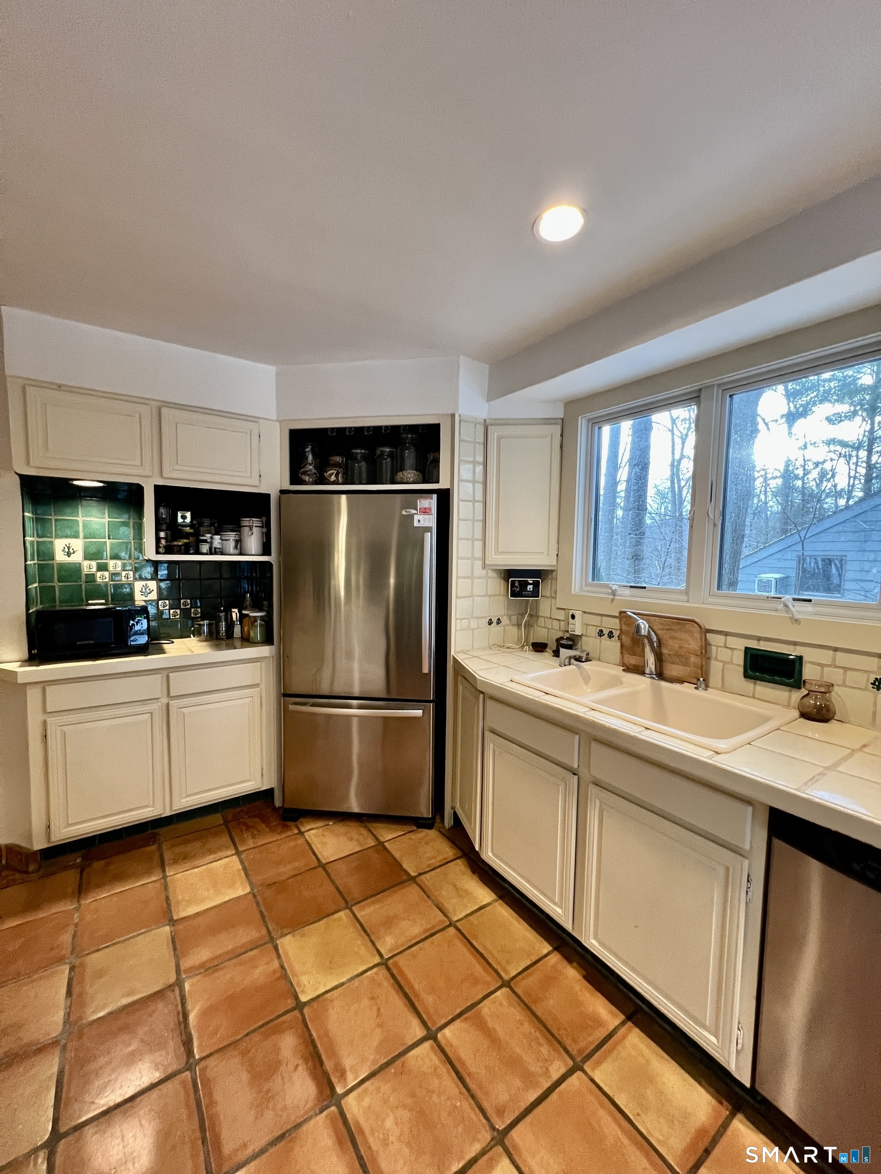 290 Cliffside Drive Torrington, CT 06790 - Photo 14 of 40 a kitchen with stainless steel appliances a refrigerator sink and cabinets