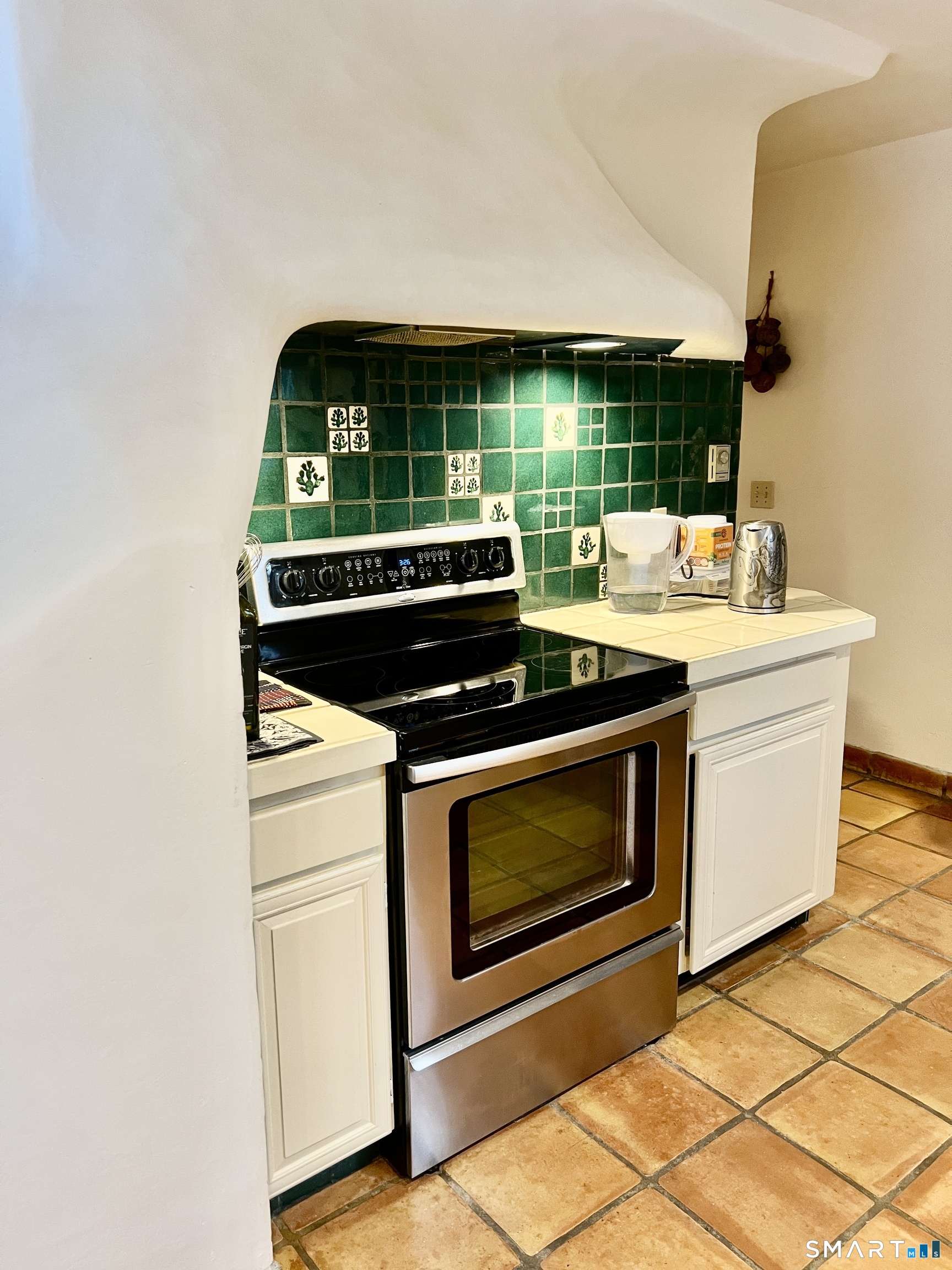 290 Cliffside Drive Torrington, CT 06790 - Photo 15 of 40 a kitchen with a stove and cabinets