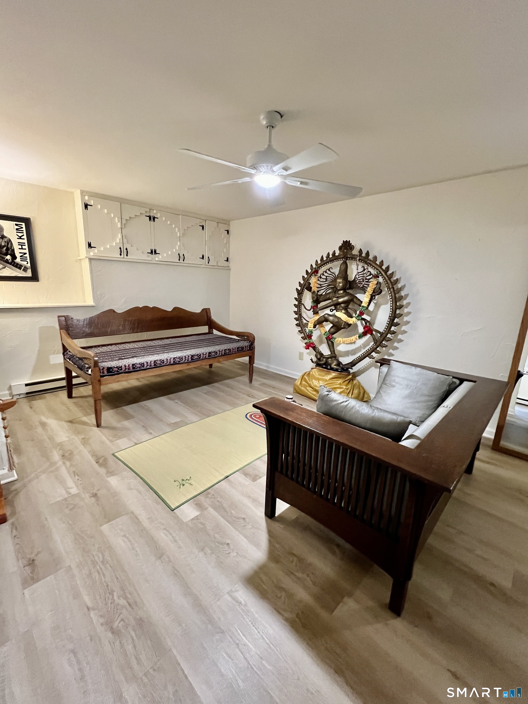 290 Cliffside Drive Torrington, CT 06790 - Photo 32 of 40 a living room with furniture a rug and a chandelier