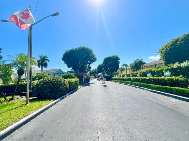 a view of a street with a building in the background
