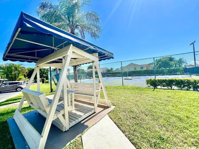 a view of a backyard with sitting area