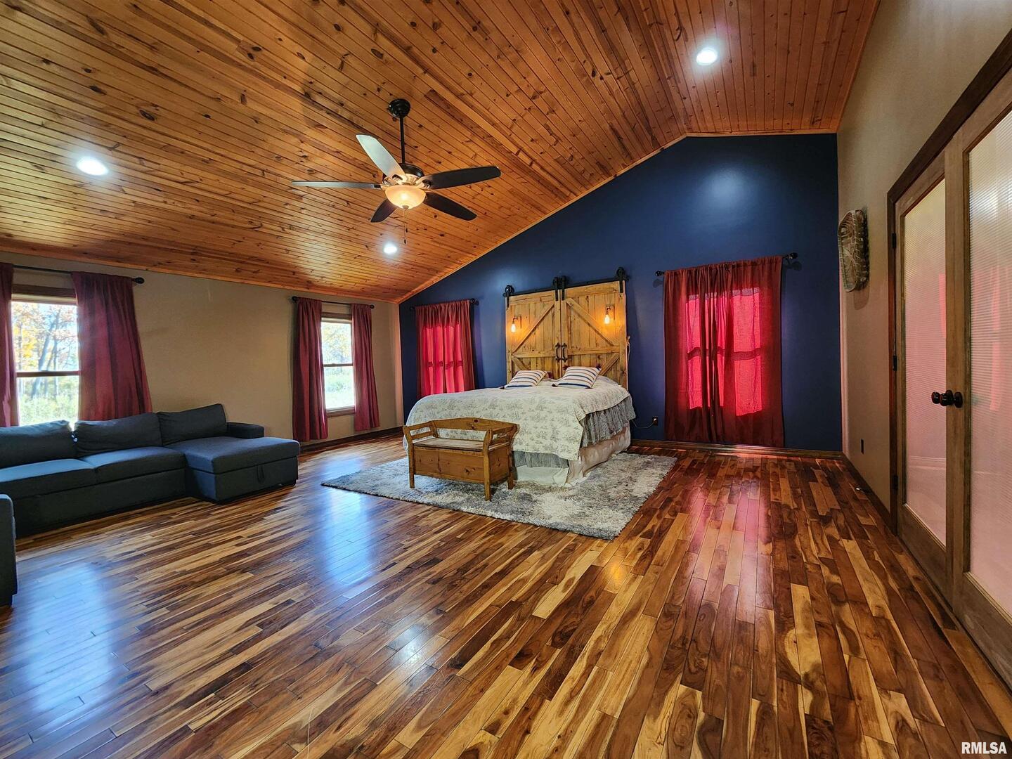 253 Ween Road De Soto, IL 62924 - Photo 11 of 56 a living room with hardwood floor furniture a ceiling fan and a window