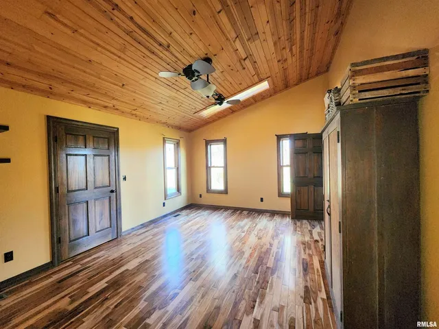a view of living room with furniture and a fireplace