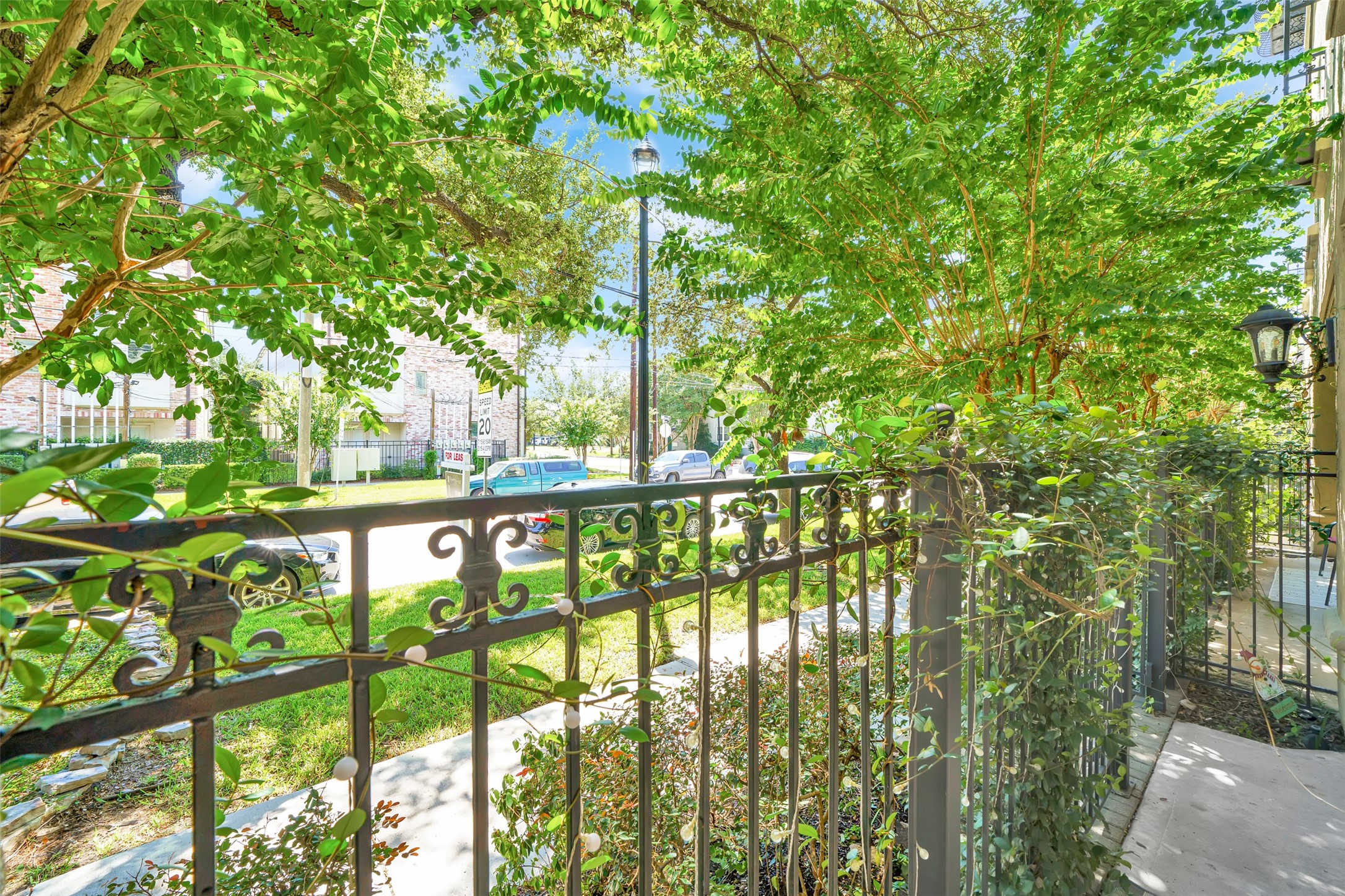 2216 Chenevert Street, Unit 6 Houston, TX 77003 - Photo 23 of 29 View from the private patio out to the quiet tree-lined street.
