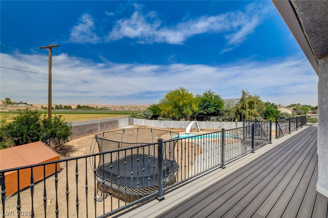 4362 Thistle Street Logandale, NV 89021 - Photo 68 of 99 An elevated deck offers panoramic views of the expansive yard, private pool, and surrounding landscape.