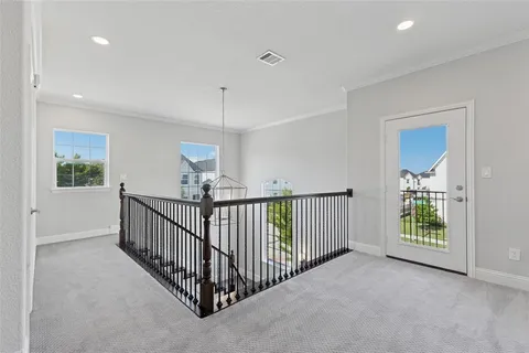 a view of a hallway with windows