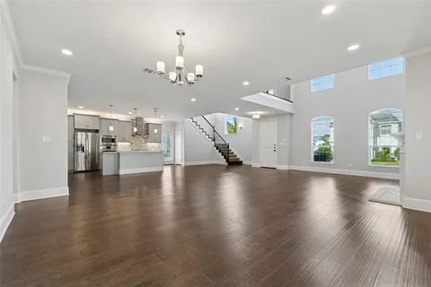 a view of a living room and kitchen with a large window
