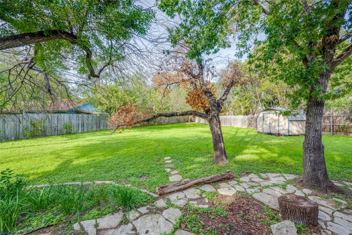 1402 Meadgreen Circle Austin, TX 78758 - Photo 30 of 35 Fenced backyard with an outdoor structure