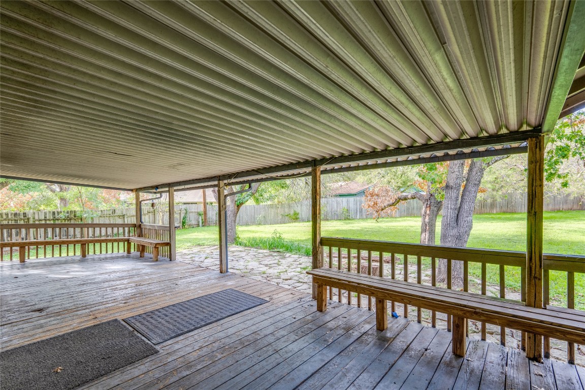 1402 Meadgreen Circle Austin, TX 78758 - Photo 31 of 35 Wooden terrace featuring a fenced backyard