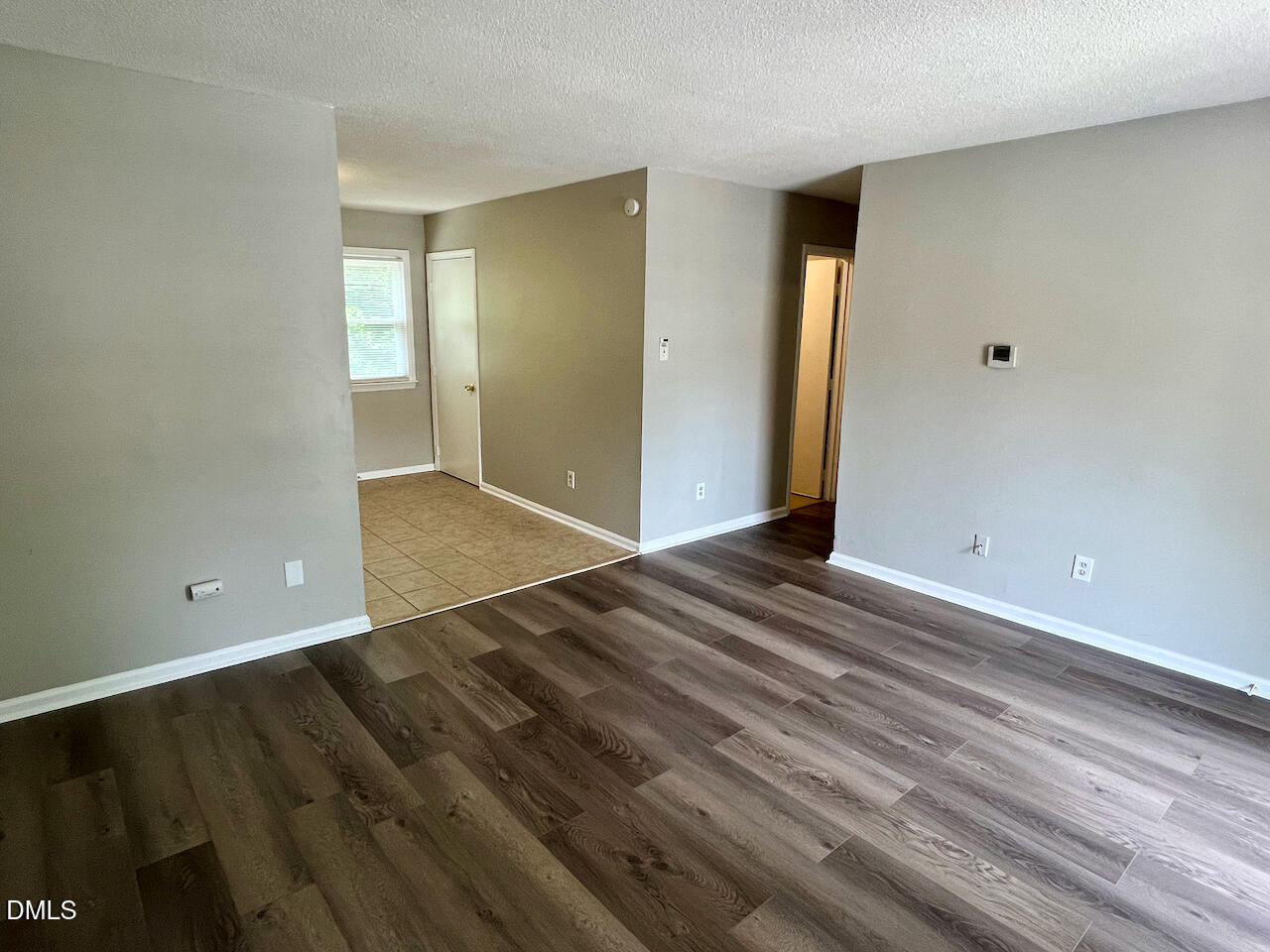 1320 Poole Road, Unit L Raleigh, NC 27610 - Photo 3 of 12 a view of a room with wooden floor