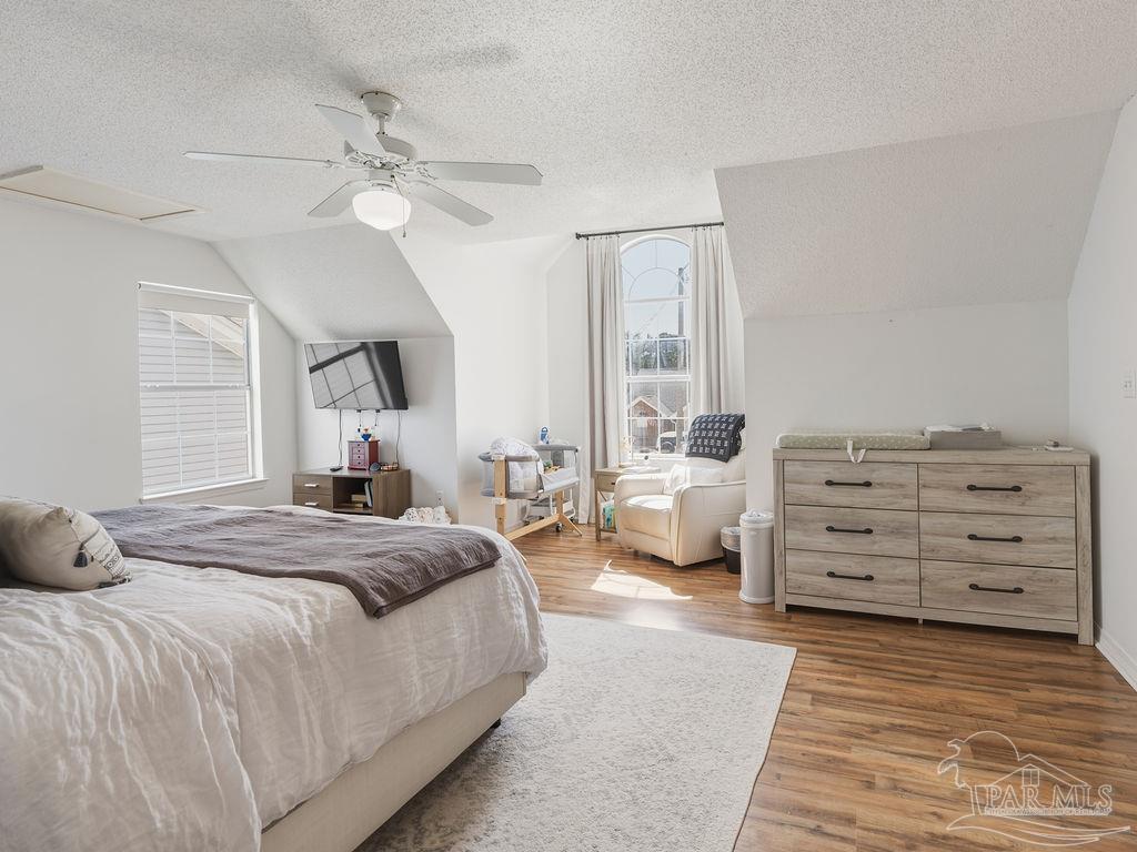 446 Sandy Ridge Circle Mary Esther, FL 32569 - Photo 12 of 26 a bedroom with a bed and a dresser