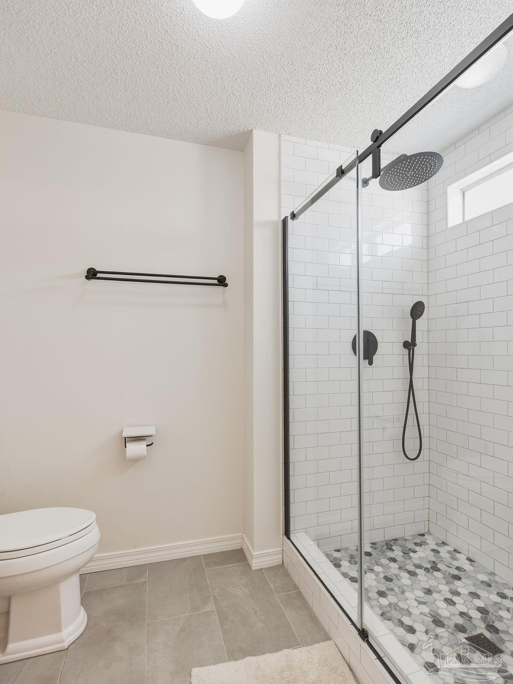 446 Sandy Ridge Circle Mary Esther, FL 32569 - Photo 13 of 26 a bathroom with a shower and toilet