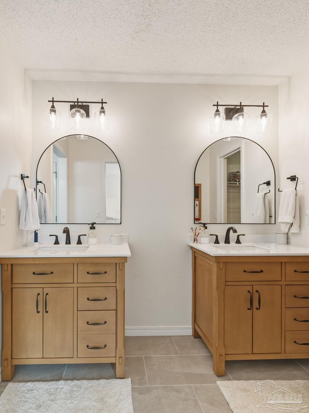 446 Sandy Ridge Circle Mary Esther, FL 32569 - Photo 14 of 26 a bathroom with a sink and a mirror