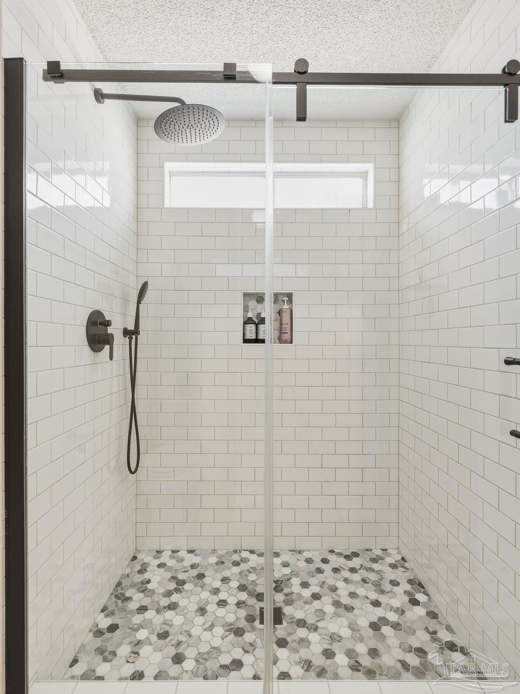 446 Sandy Ridge Circle Mary Esther, FL 32569 - Photo 16 of 26 a bathroom with a shower