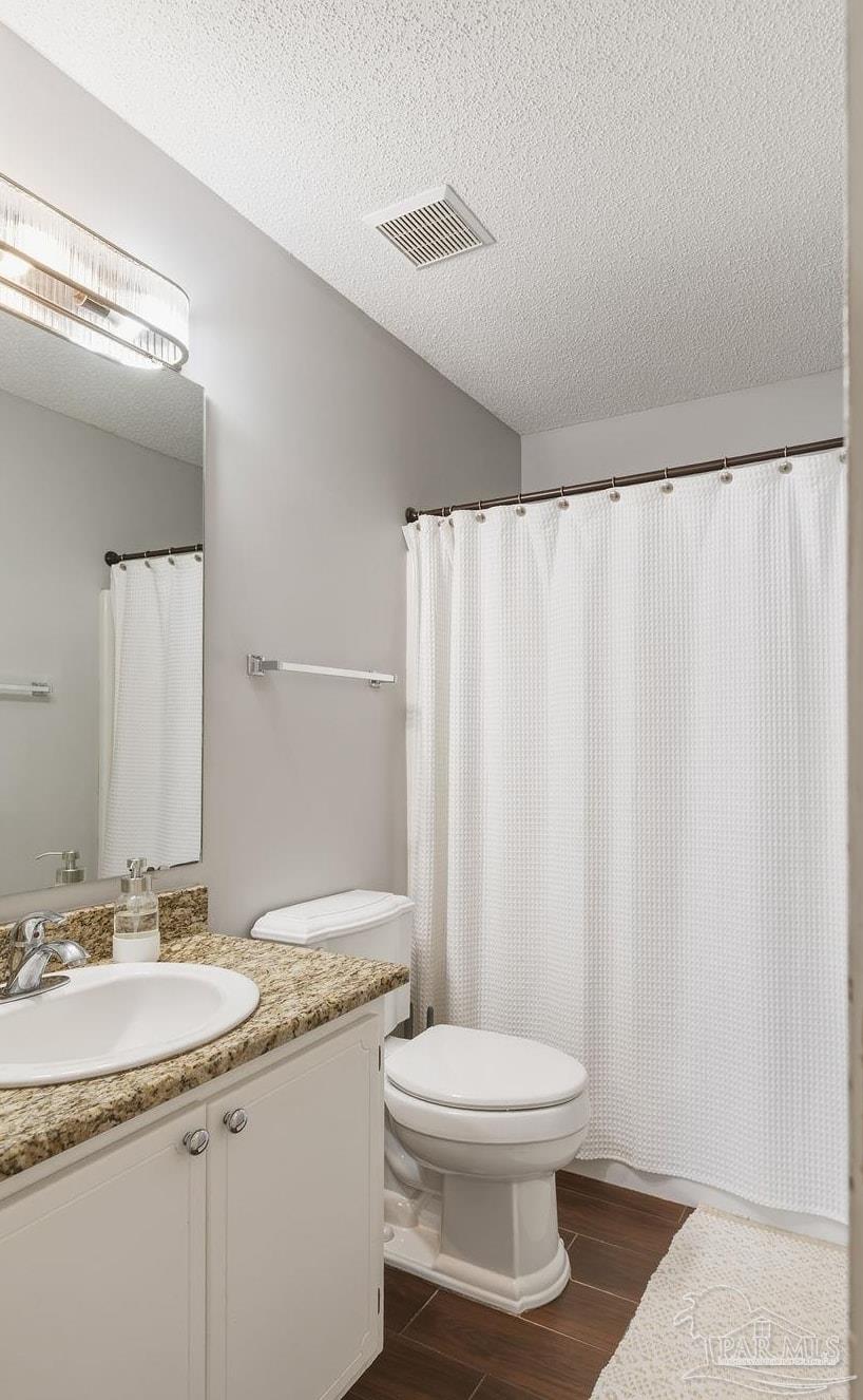 446 Sandy Ridge Circle Mary Esther, FL 32569 - Photo 19 of 26 a bathroom with a granite countertop sink toilet and a mirror