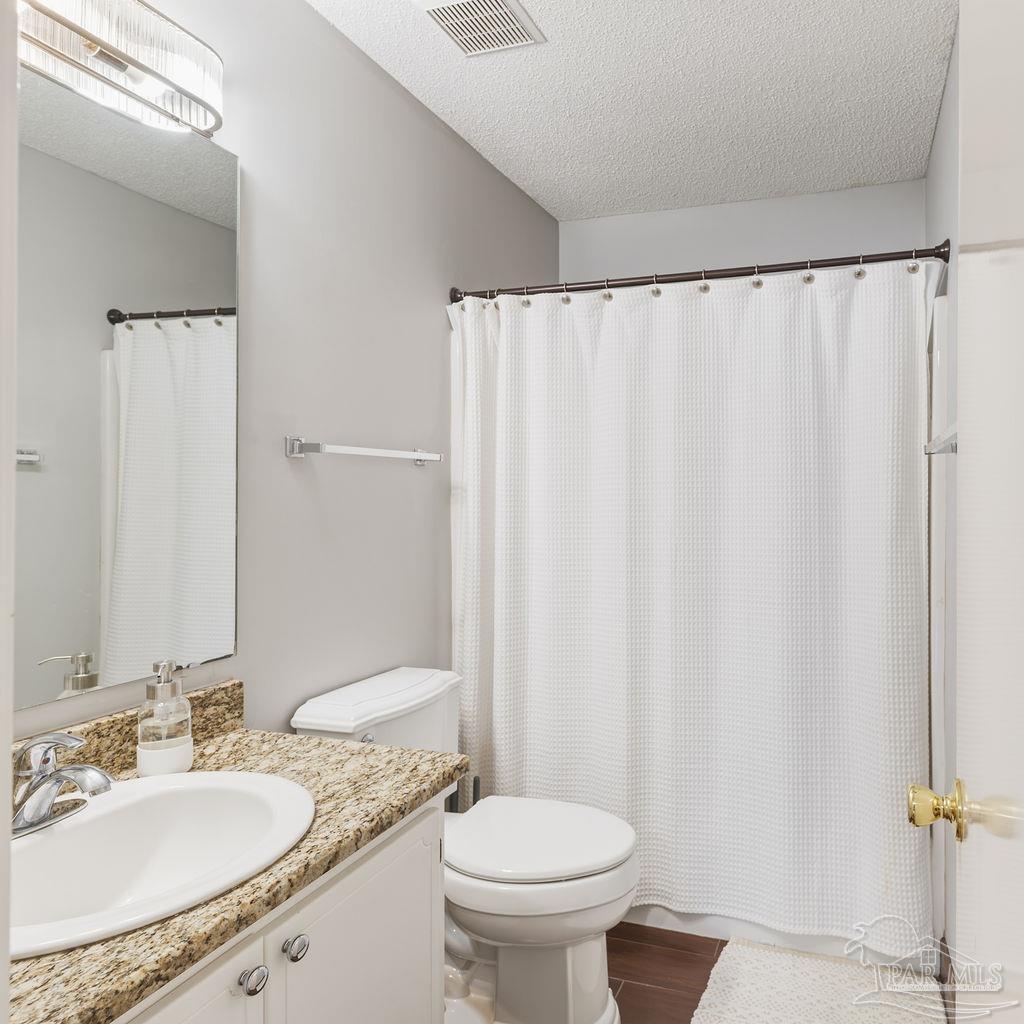 446 Sandy Ridge Circle Mary Esther, FL 32569 - Photo 20 of 26 a bathroom with a granite countertop sink and a mirror