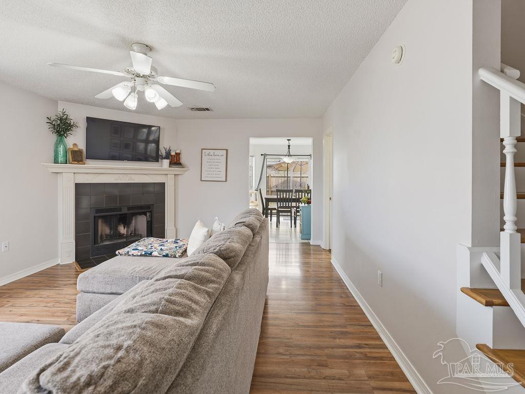446 Sandy Ridge Circle Mary Esther, FL 32569 - Photo 2 of 26 a living room with furniture and a fireplace