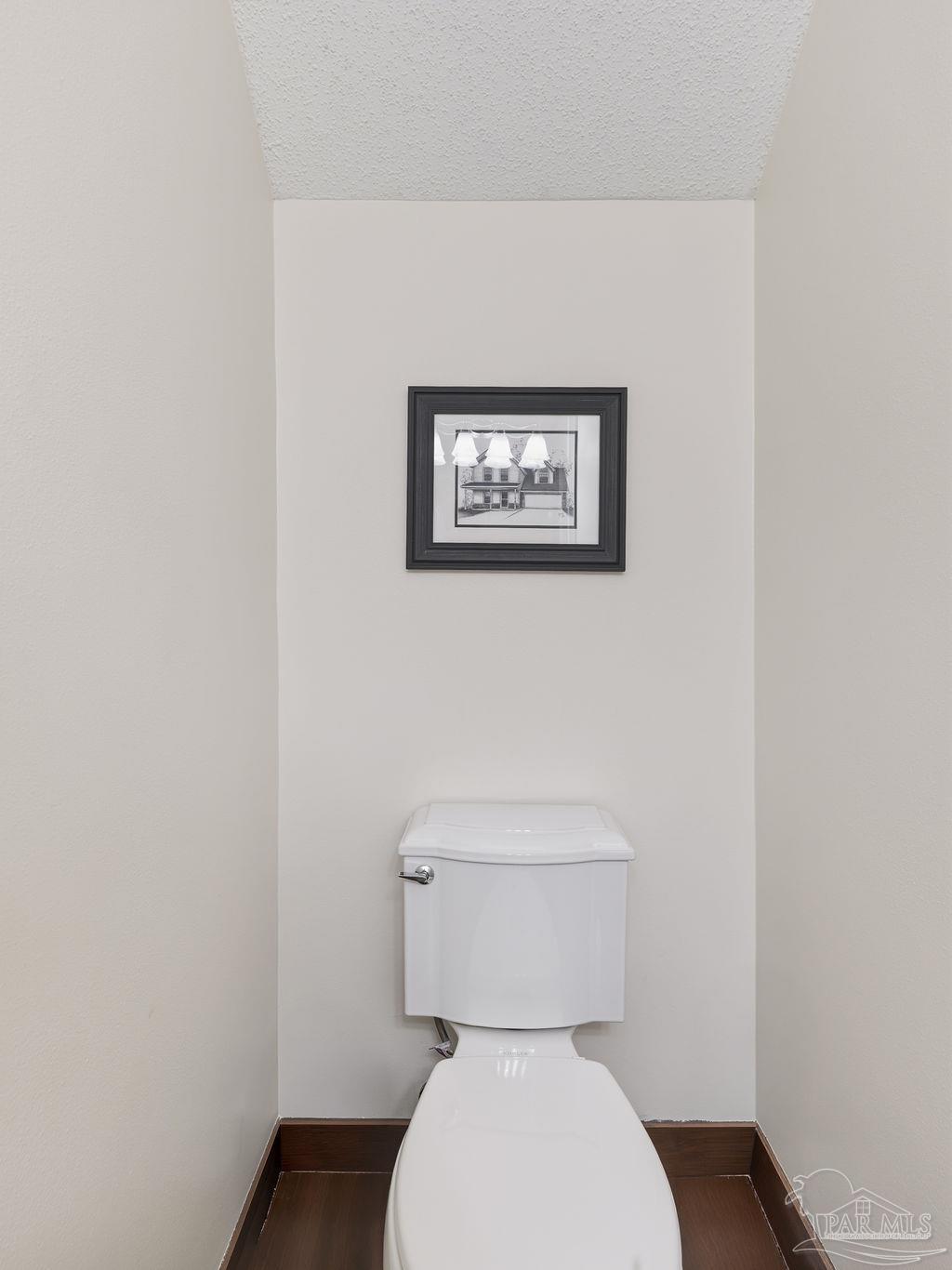 446 Sandy Ridge Circle Mary Esther, FL 32569 - Photo 23 of 26 a white toilet sitting next to a white wall