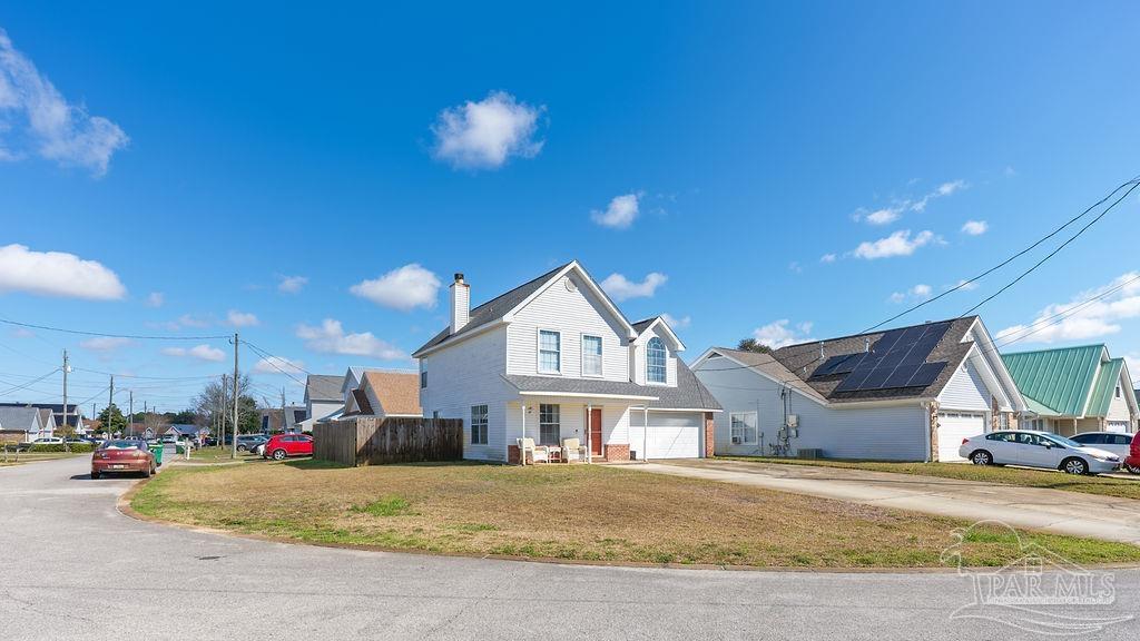 446 Sandy Ridge Circle Mary Esther, FL 32569 - Photo 26 of 26 a view of a house with a patio and a garage