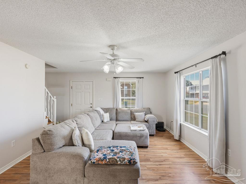 446 Sandy Ridge Circle Mary Esther, FL 32569 - Photo 3 of 26 a living room with furniture and a large window