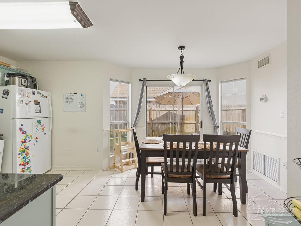 446 Sandy Ridge Circle Mary Esther, FL 32569 - Photo 6 of 26 a view of a dining room with furniture
