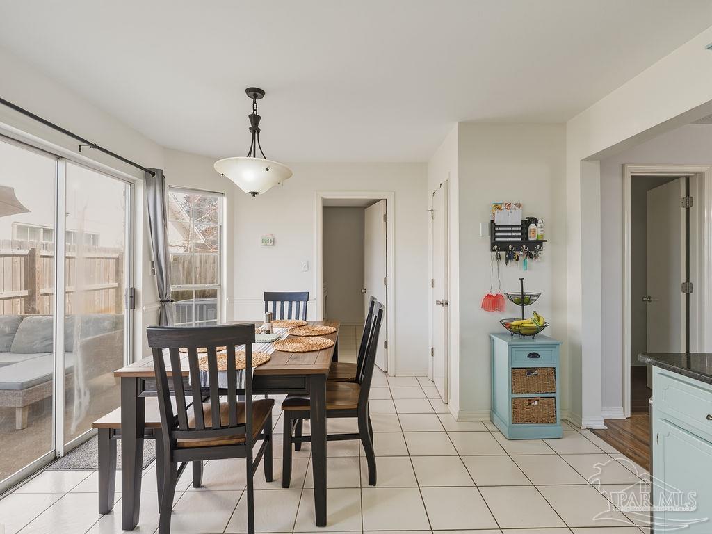 446 Sandy Ridge Circle Mary Esther, FL 32569 - Photo 8 of 26 a dining room with furniture and window