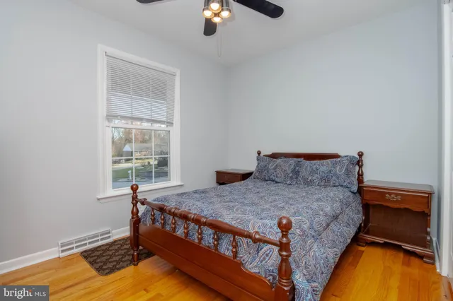 a bed room with a bed and a lamp