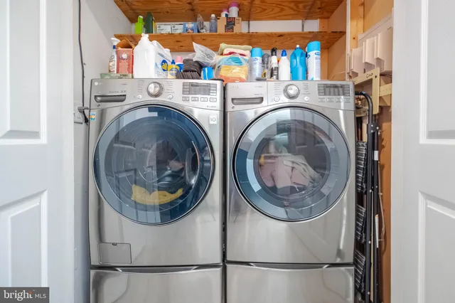 a view of a livingroom with wooden floor and entrance