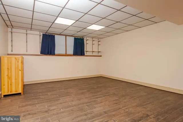 a bathroom with a toilet and a shower curtain