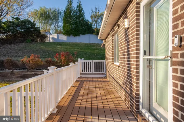 a view of a backyard with large trees