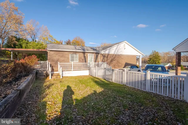 a view of a backyard with sitting area