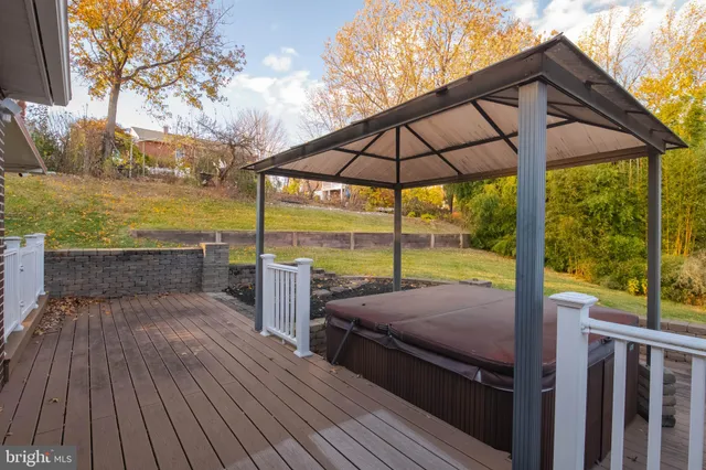 a view of a terrace with wooden floor and seating space