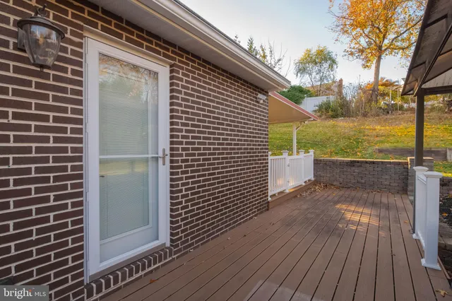 a view of a swimming pool with an outdoor space and seating area