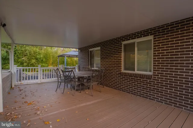 a view of a backyard with wooden fence