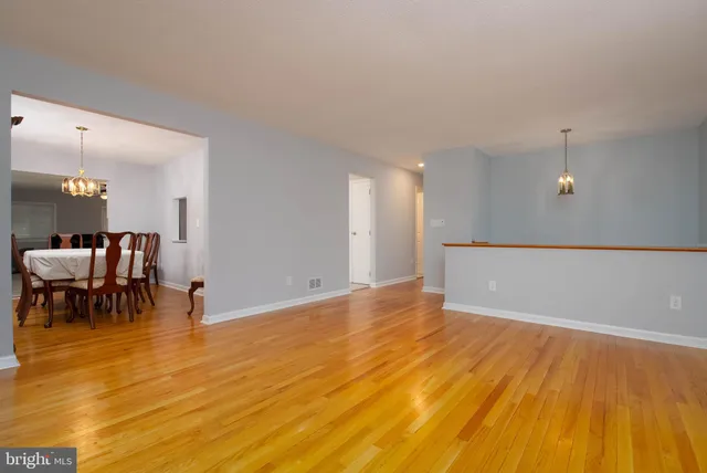 a view of dining room with furniture and wooden floor