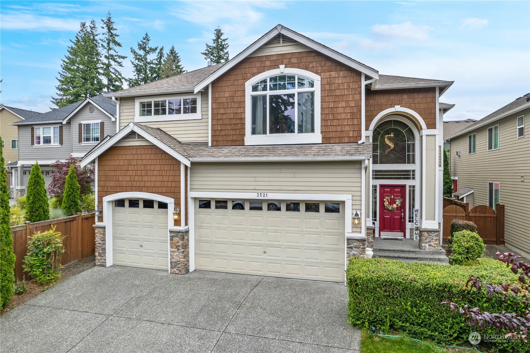 3521 214th Place Southeast Bothell, WA 98021 - Photo 1 of 35 a front view of a house with a garage