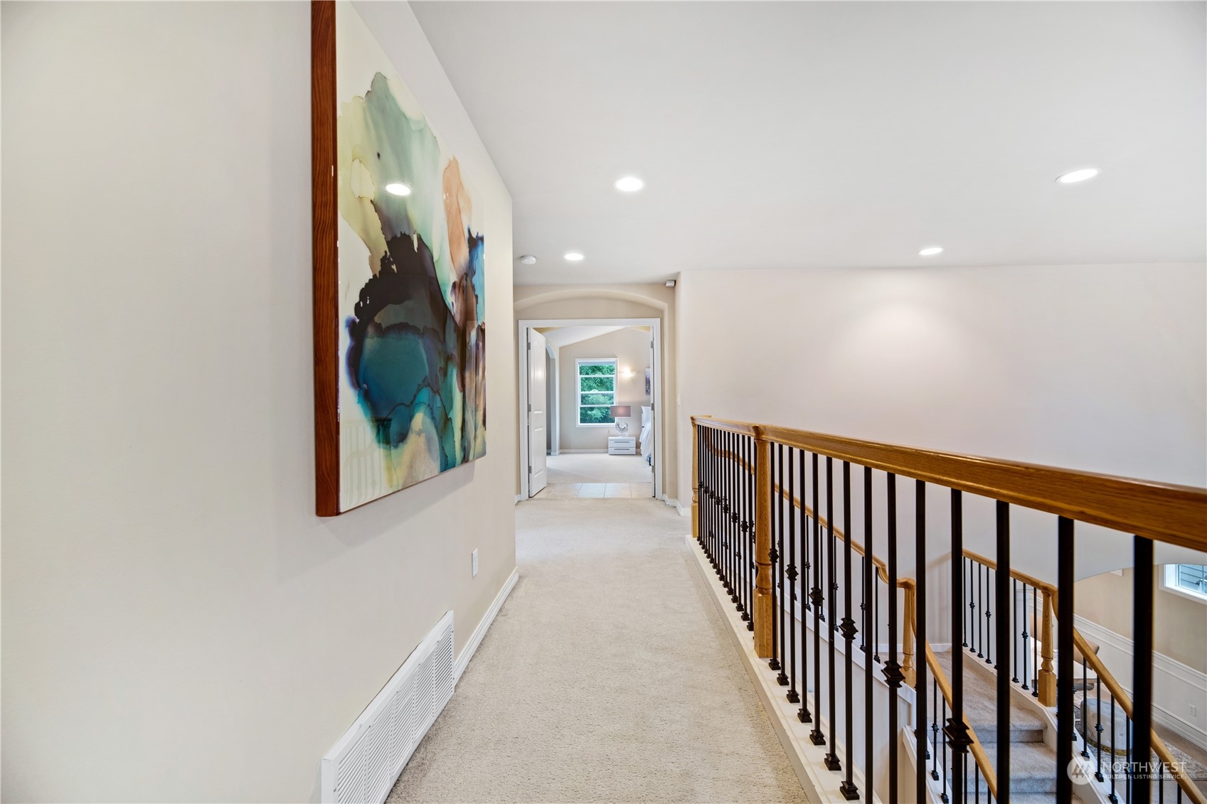3521 214th Place Southeast Bothell, WA 98021 - Photo 22 of 35 a view of a hallway with wooden floor and stairs