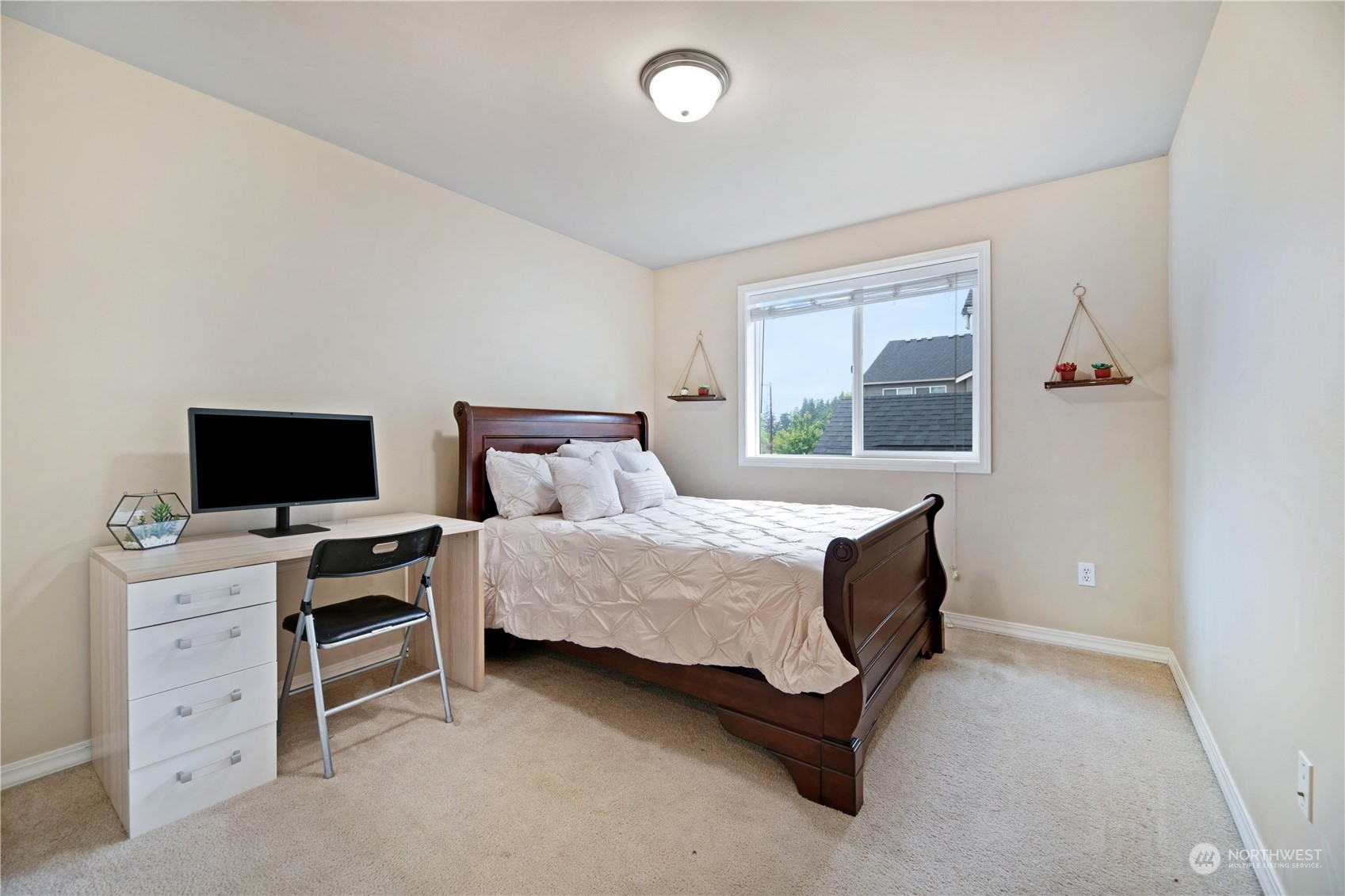 3521 214th Place Southeast Bothell, WA 98021 - Photo 24 of 35 a bedroom with a bed and a flat screen tv