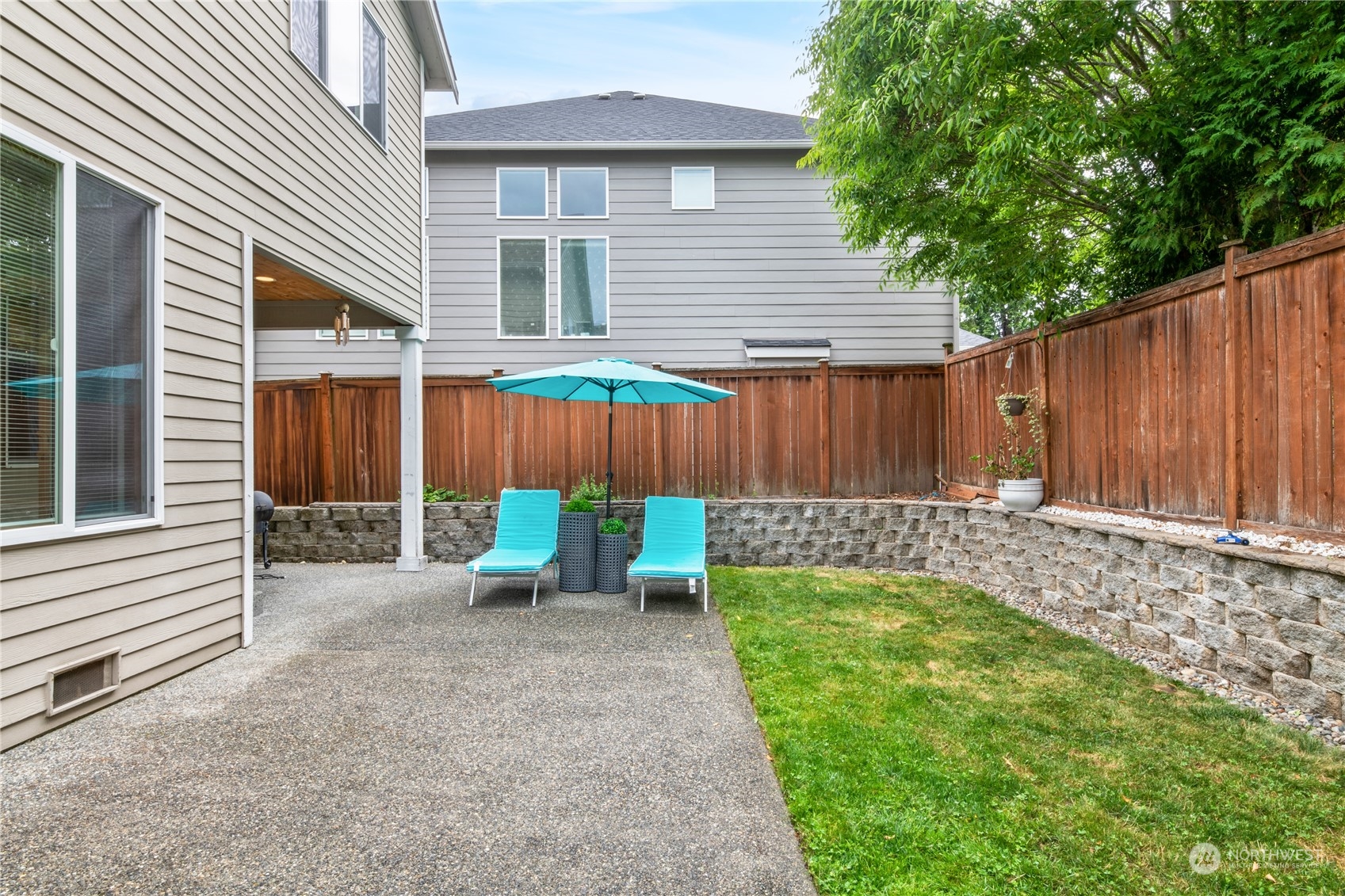 3521 214th Place Southeast Bothell, WA 98021 - Photo 31 of 35 a view of a backyard with a small cabin and a chair
