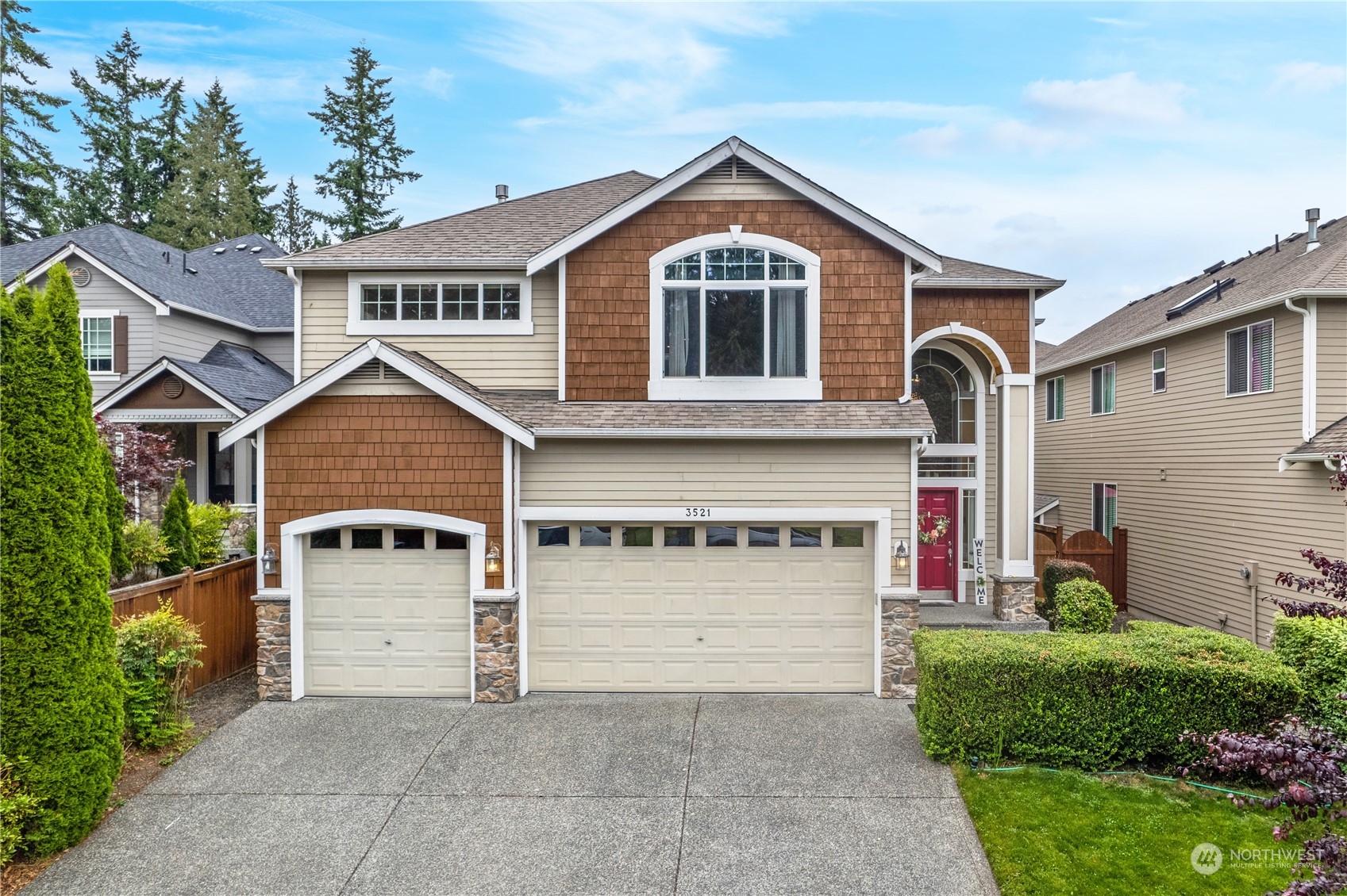 3521 214th Place Southeast Bothell, WA 98021 - Photo 34 of 35 a front view of a house with a yard and garage