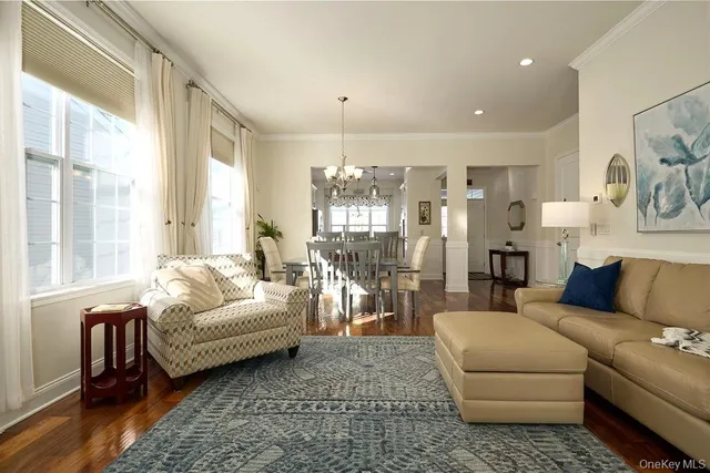 a view of a livingroom with furniture and a window